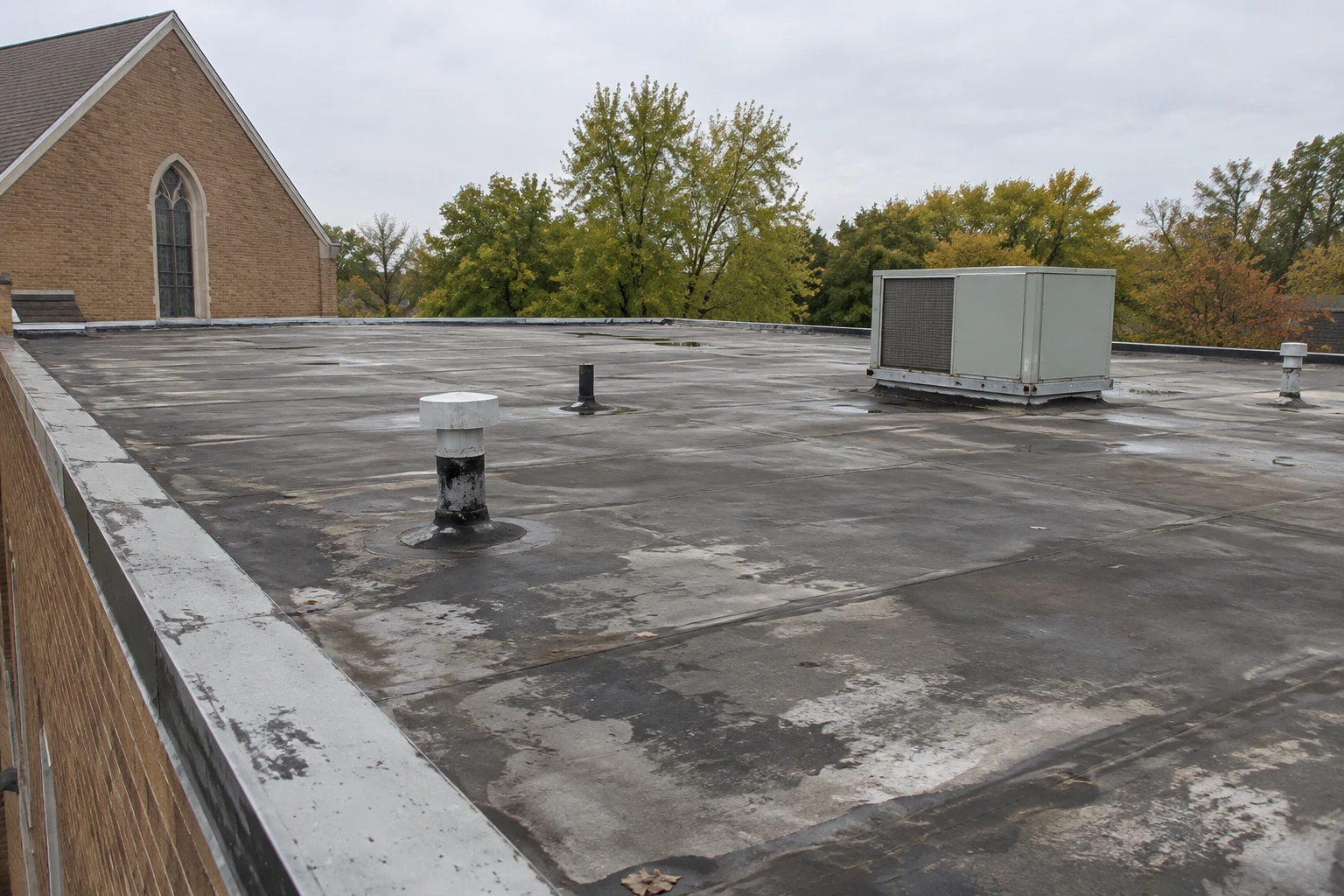 Commercial Roofing Centennial worker working on plans for a  concrete construction project