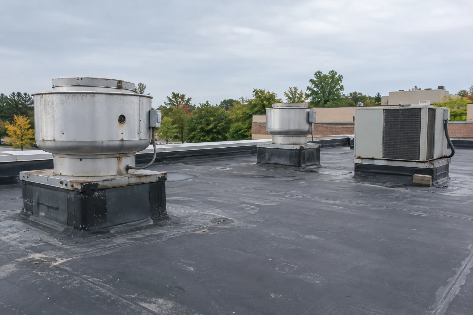 Commercial Roofing Centennial worker working on plans for a  concrete construction project