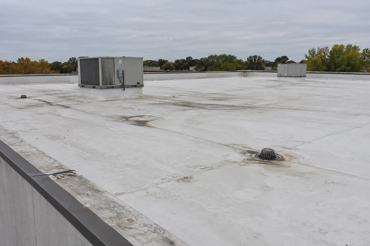 Commercial Roofing Centennial worker working on plans for a  concrete construction project