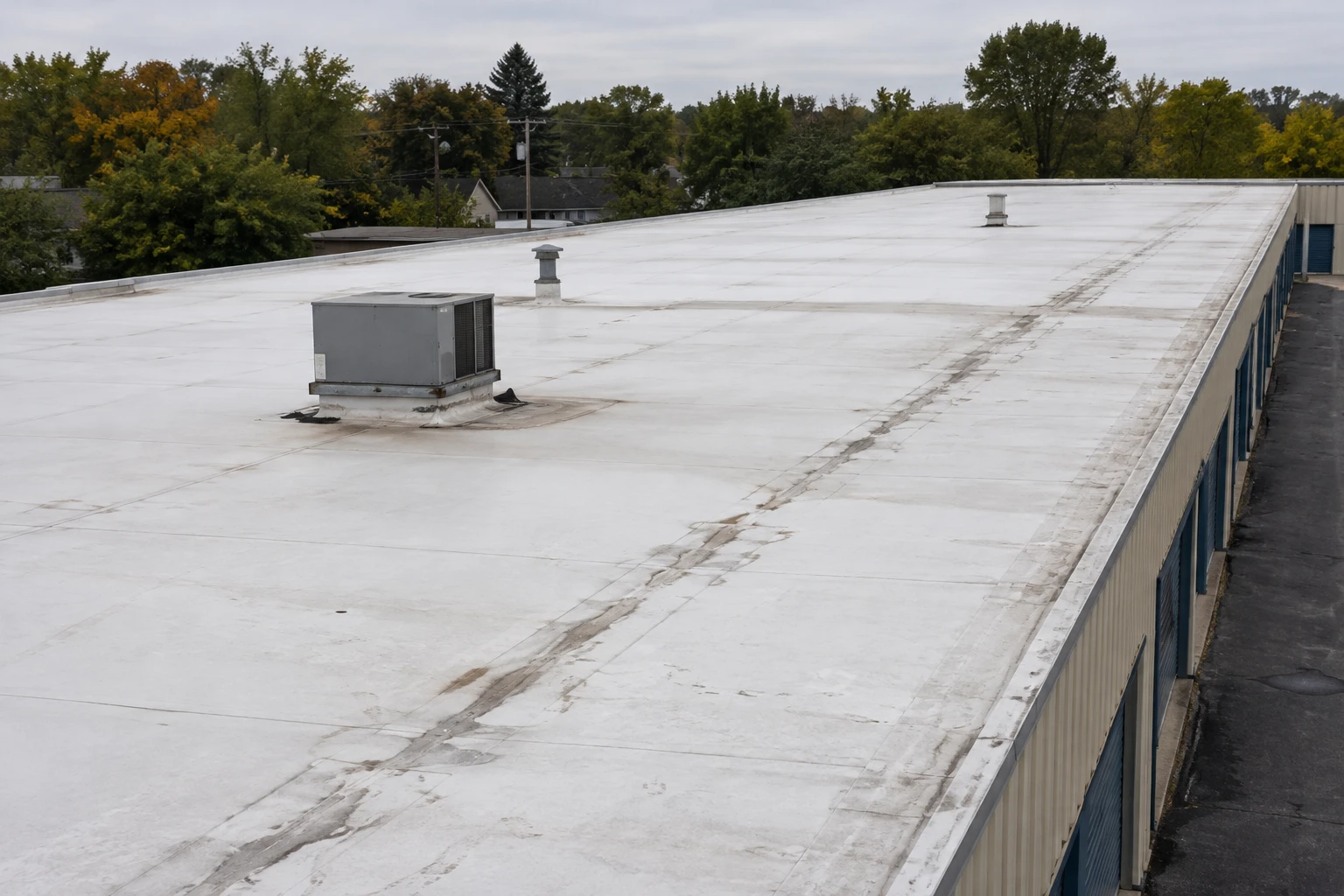 Commercial Roofing Centennial worker working on plans for a  concrete construction project